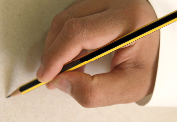 Researcher holding a pencil to write