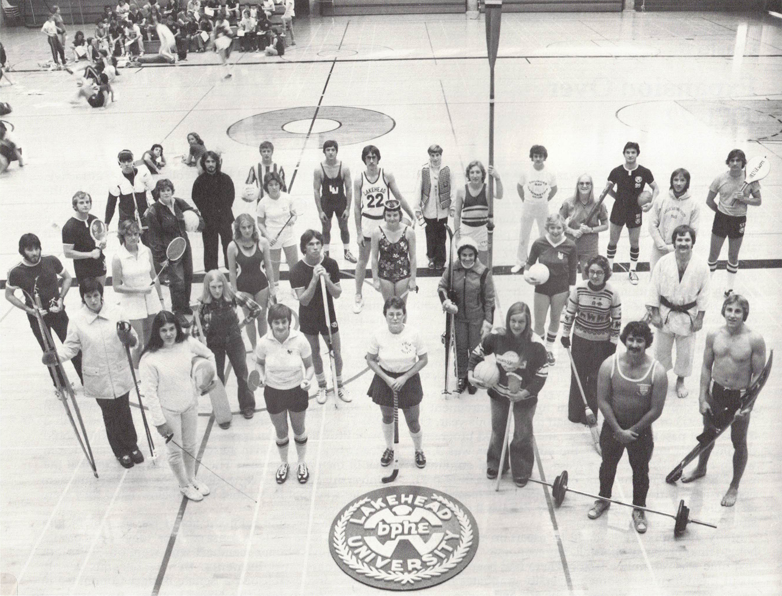 Students in the Fieldhouse representing the different sporting activities offered by the program in the 1970s.