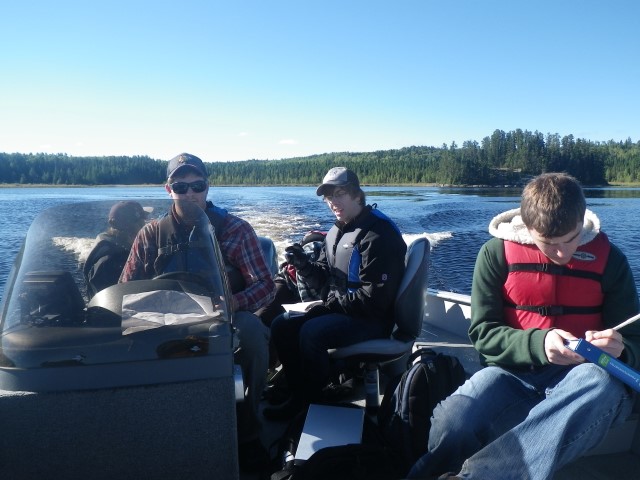 a group of students on a boat