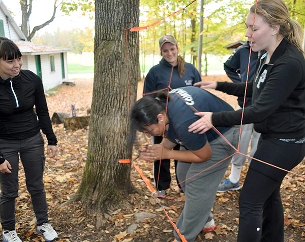 The “spider web challenge” taught students how to work together as a team to accomplish a task. 