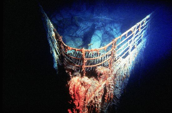A movie still from filmmaker Stephen Low's movie about the unforgiving north atlantic. The photo displays the front of a large ship completely covered by a thick layer of ice