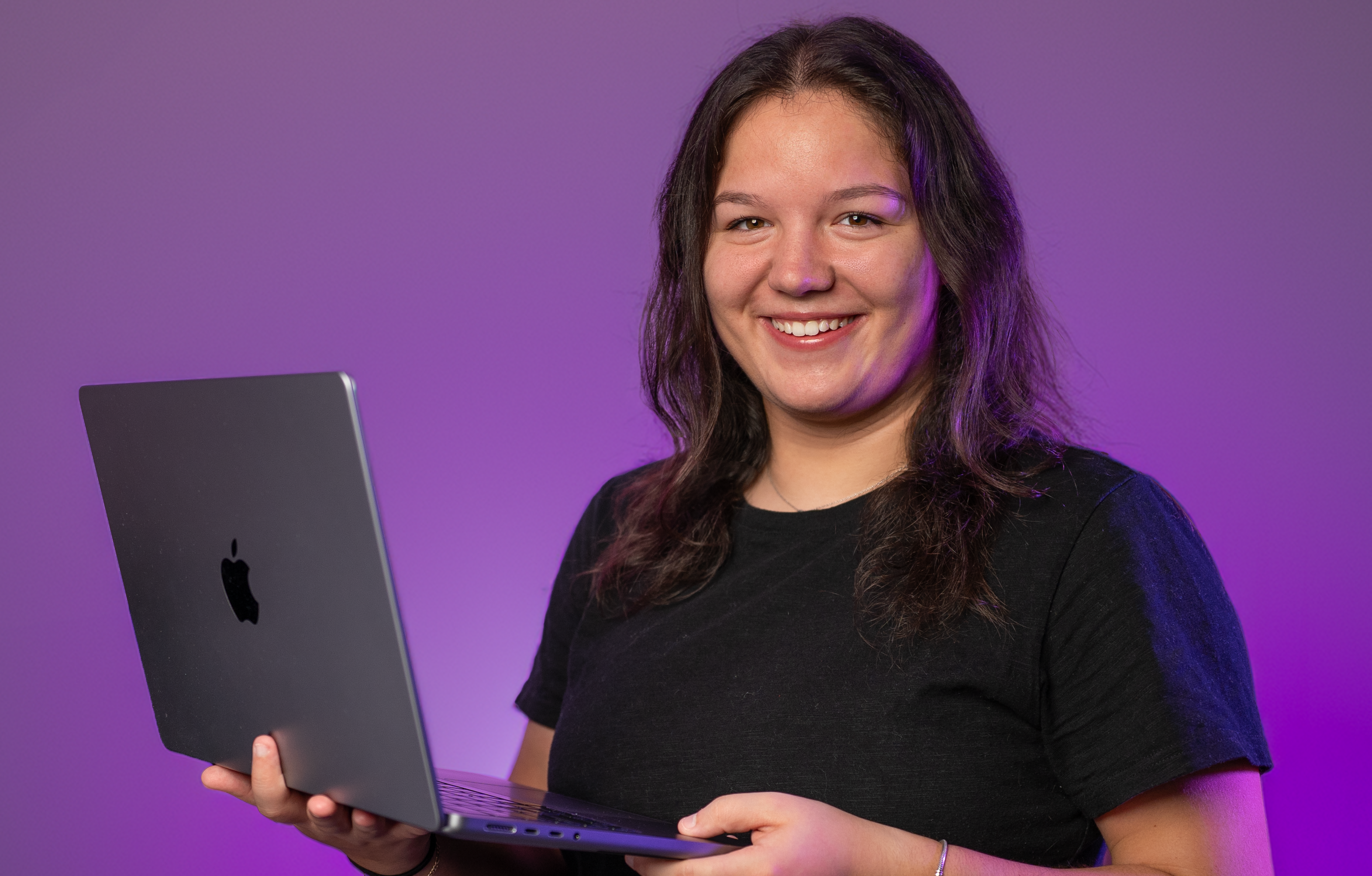 Lakehead student Abbygayle Welch Holds a Laptop Computer