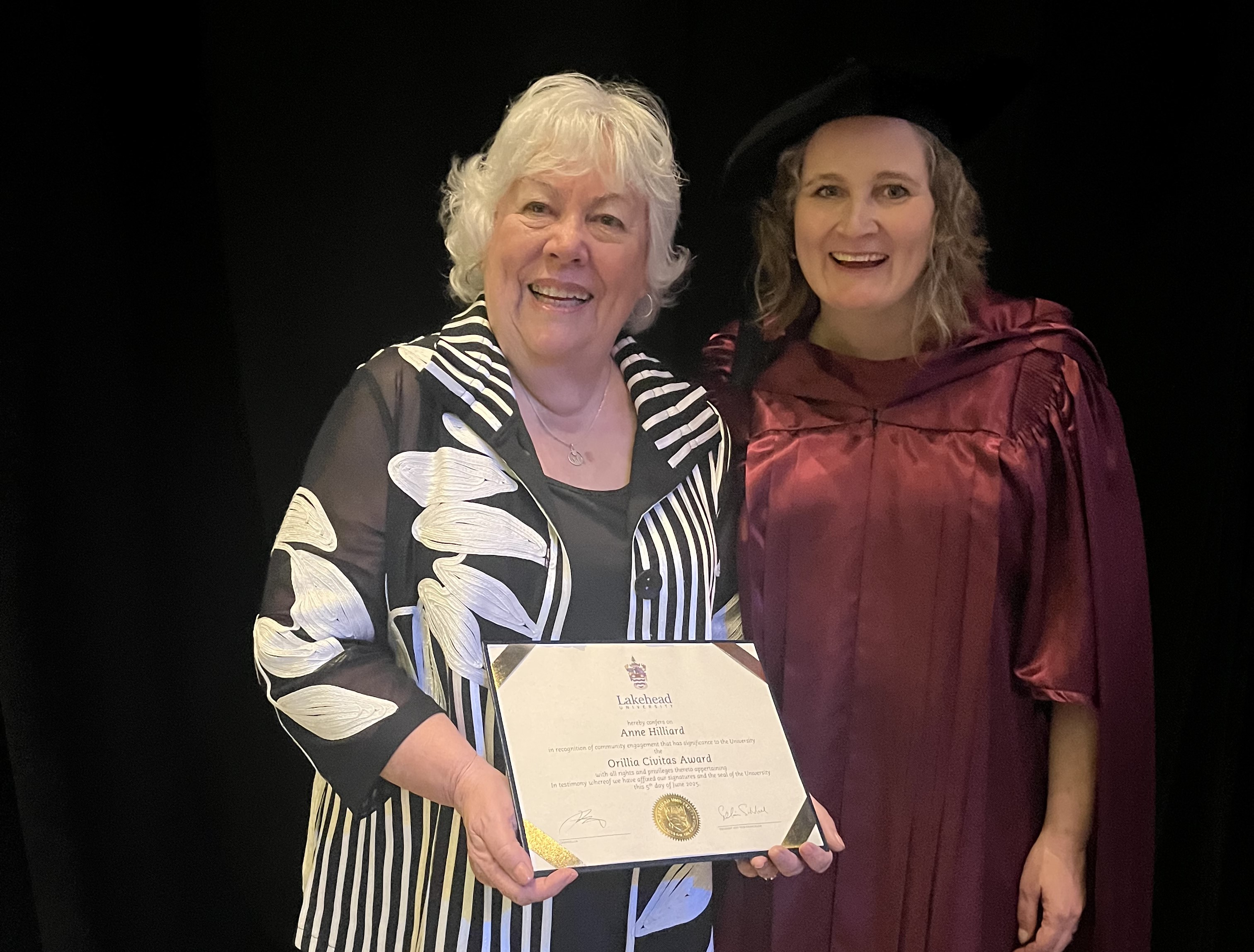 Anne Hilliard & Dr. Linda Rodenburg Anne Hilliard holds her 2025 Civitas Award while standing beside Dr. Linda Rodenburg (wearing convocation robes)