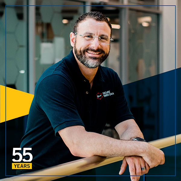 David Bruno in our new CASES building leaning over a railing smiling