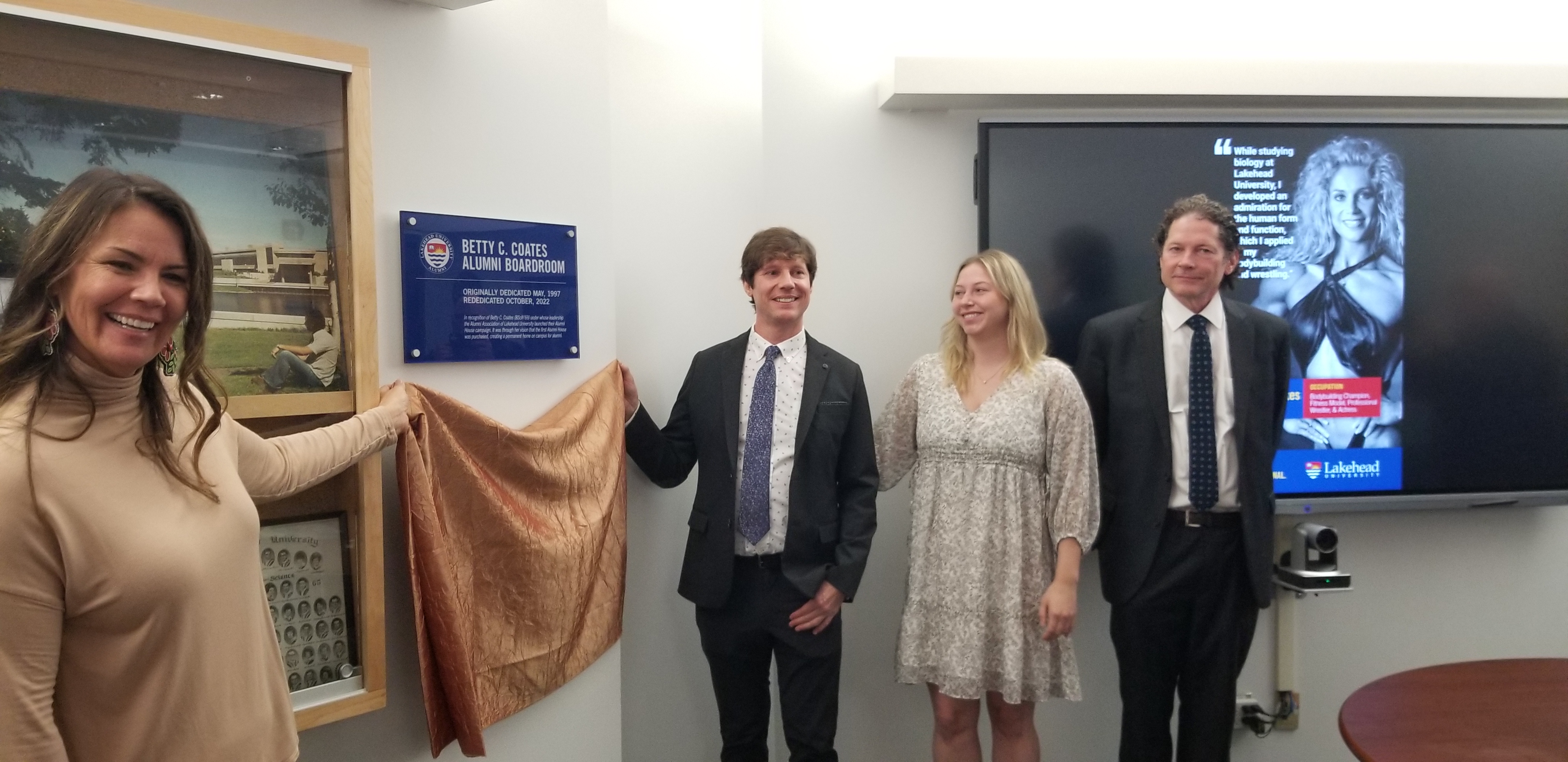 Unveiling the plaque commemorating the Betty C. Coates Boardroom