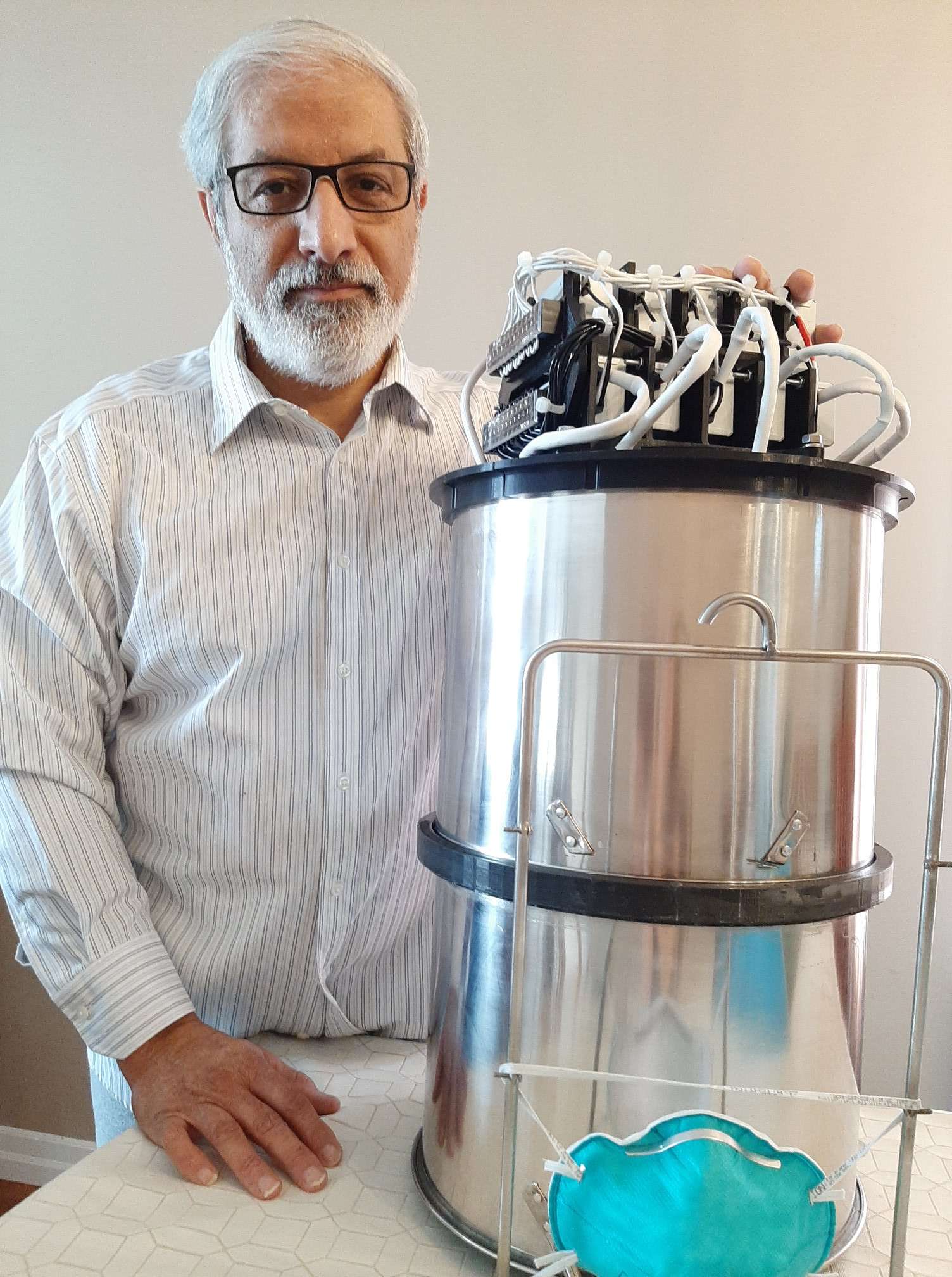 Photo of Dr. Elyasi with his prototype.