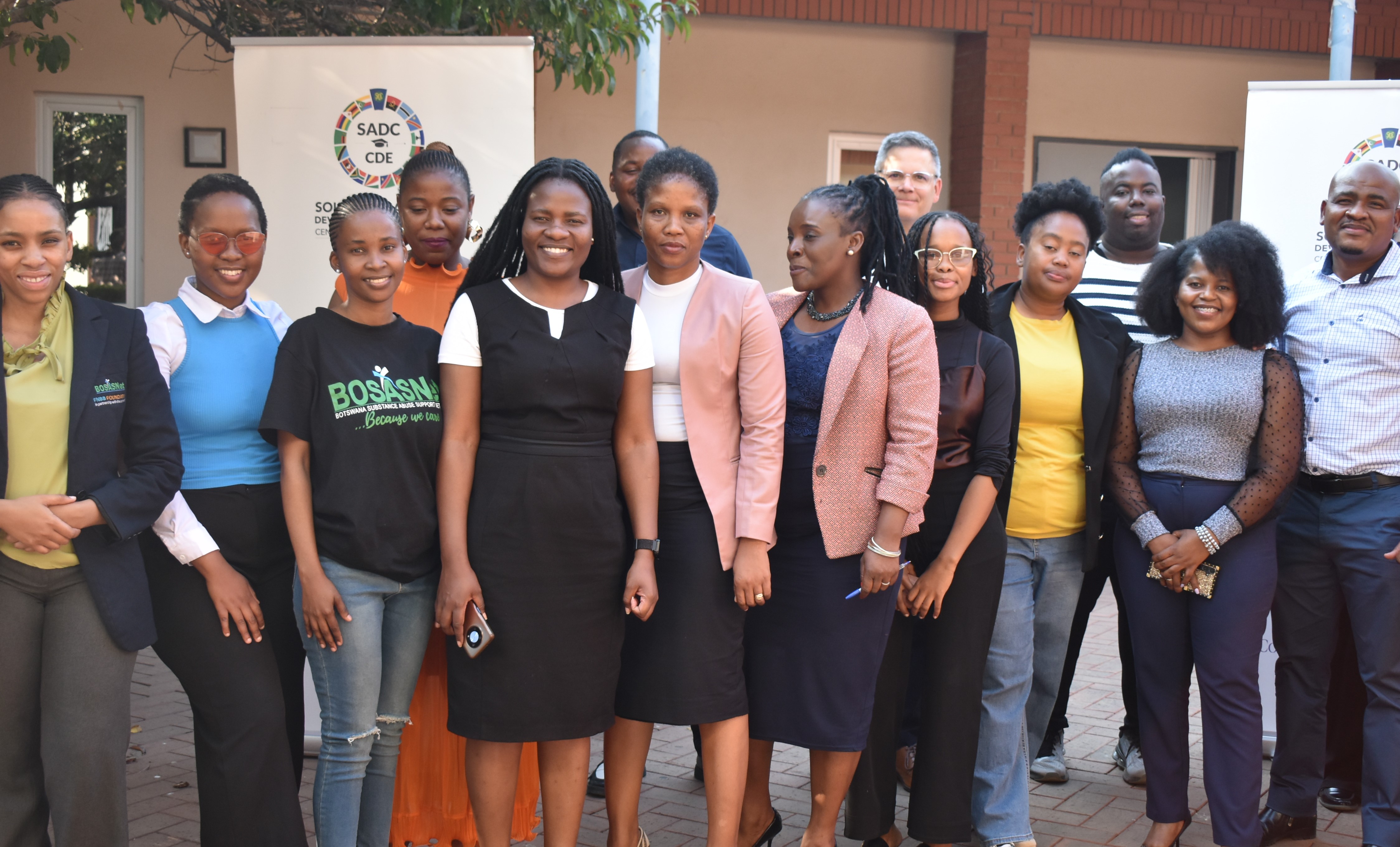 Members of the Botswana Open University in Gabarone stand outside during a conference