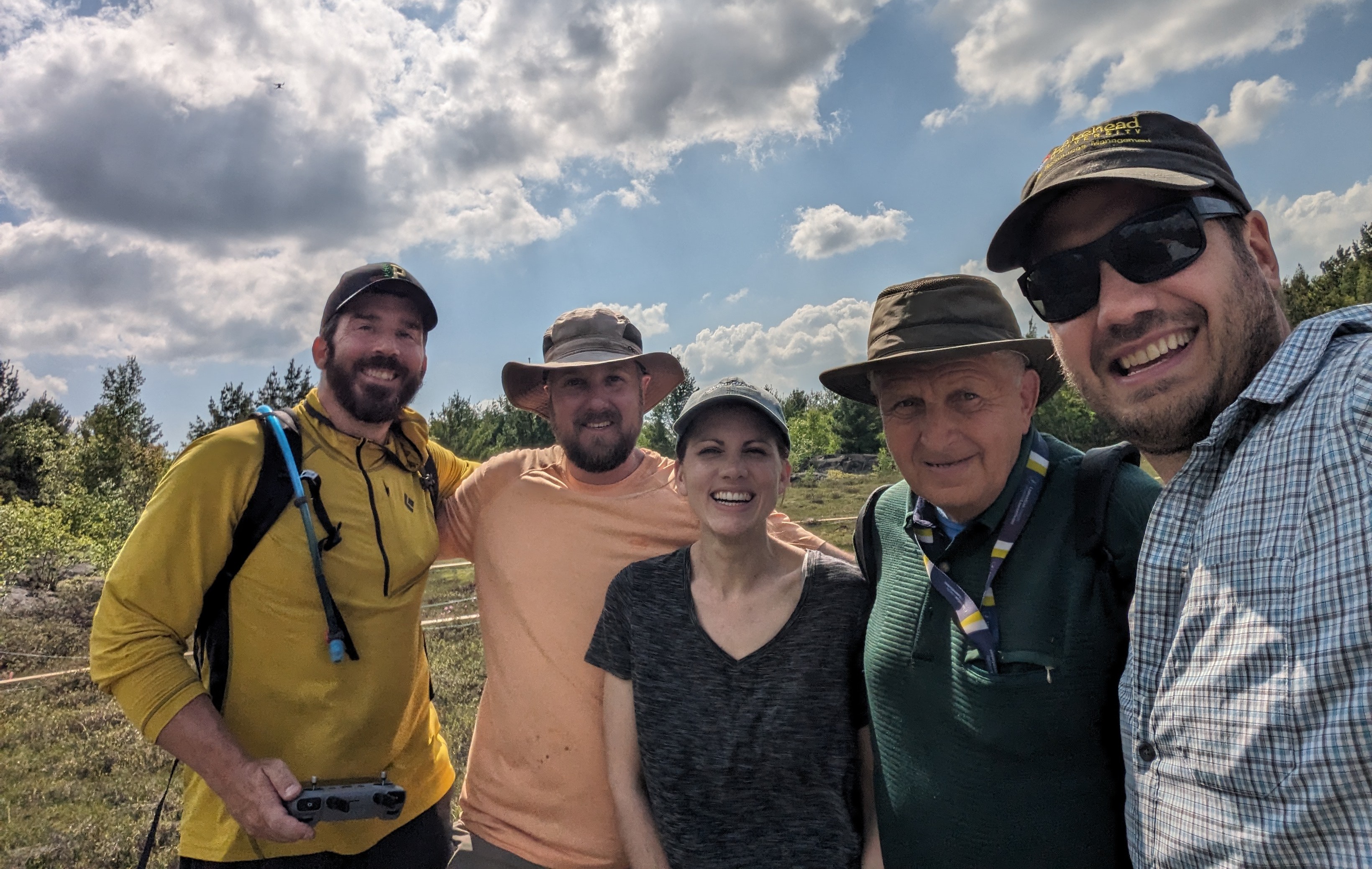 Dr. Nathan Basiliko stands with four other researchers in a Sudbury-area bog