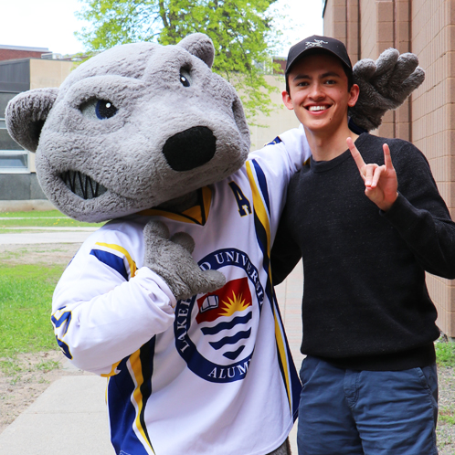 A student hanging out with Wolfie