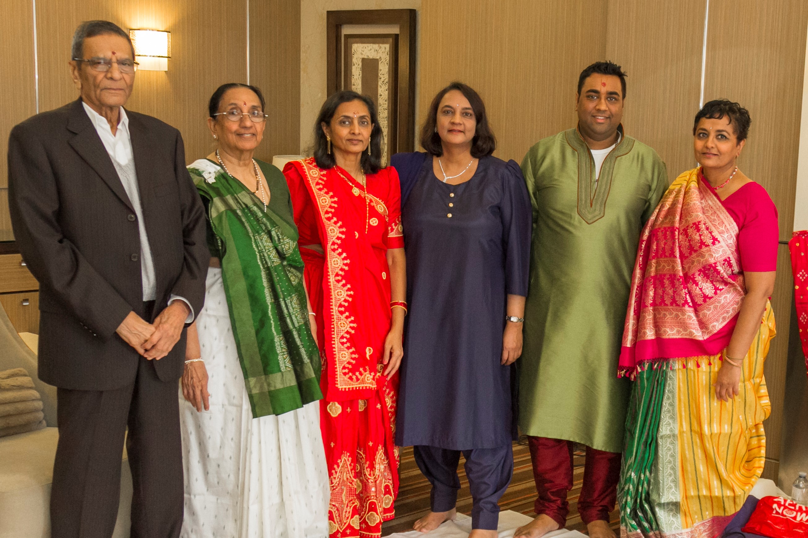 Group photo of the Patel family in formal wear
