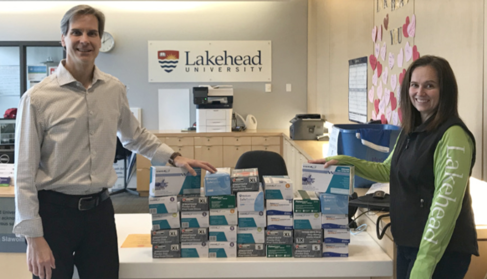 Dr. Dean Jobin-Bevans, Principal of Lakehead Orillia, and Rebecca Heffernan, Research & Strategic Initiatives Facilitator, accepted more than 4,000 pairs of gloves that went to the Orillia Soldiers' Memorial Hospital.