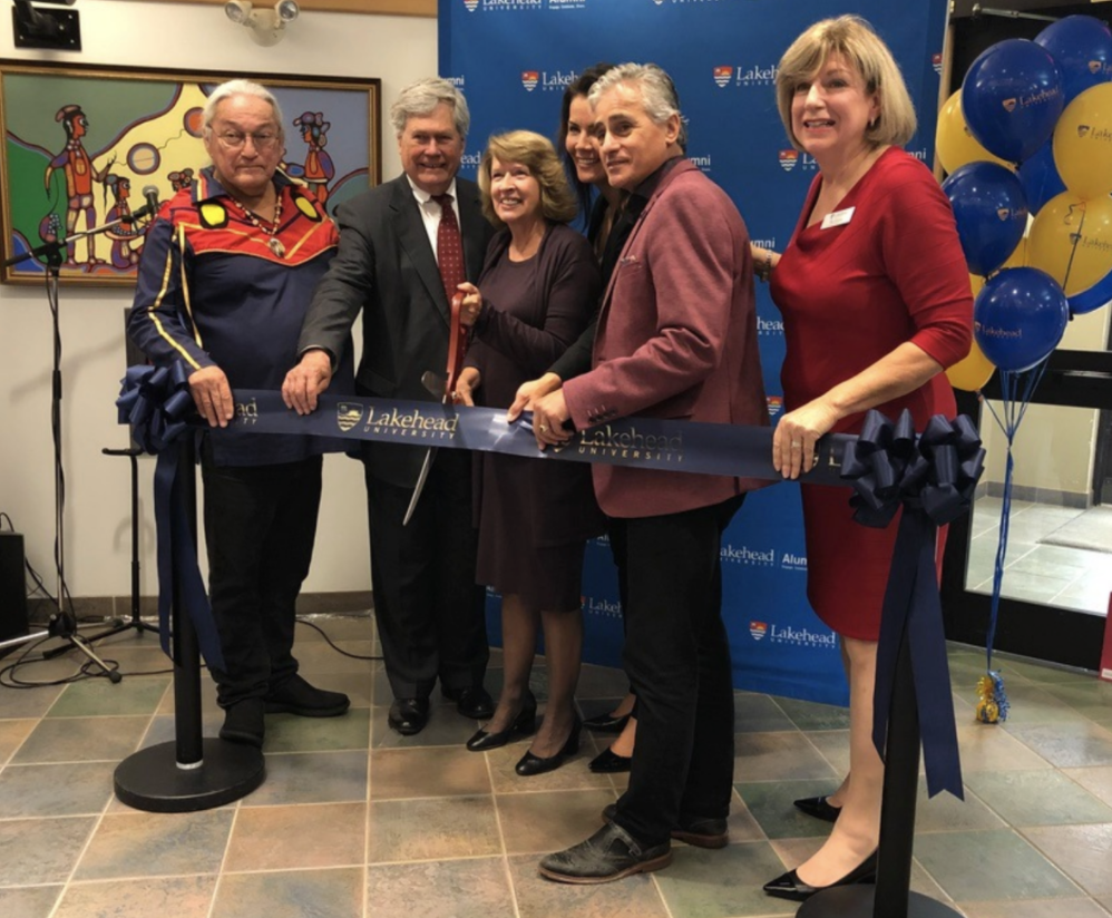 Ribbon cutting at the new Alumni House