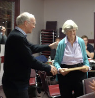 Joan Crowe receiving an award