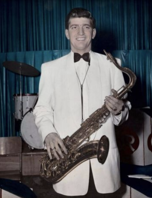Roy Coran holding saxophone