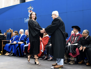 Leah crosses stage to accept her degree