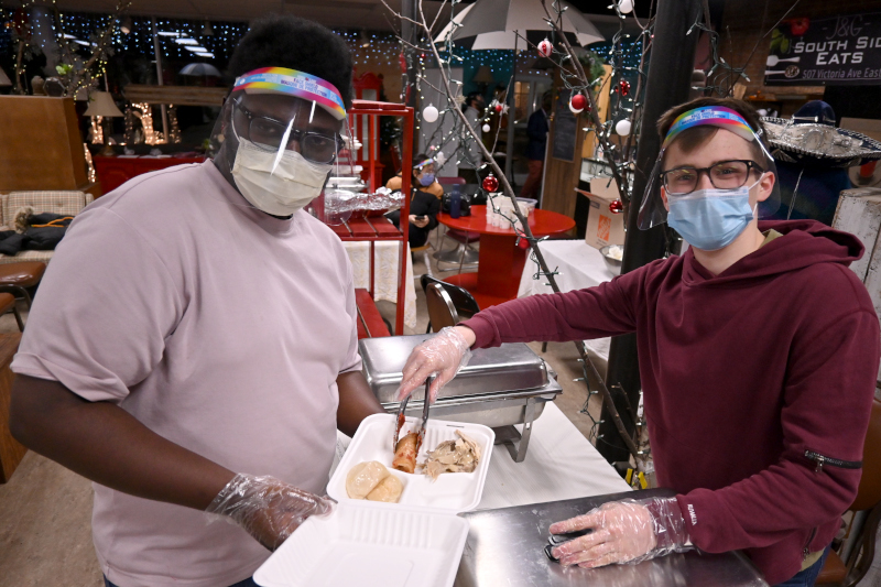 Photo of Silas Young, left, and volunteer Stephanus Appoh.