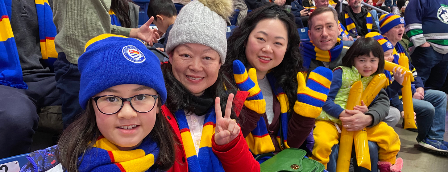 Alumni and family at a Thunderwolves game