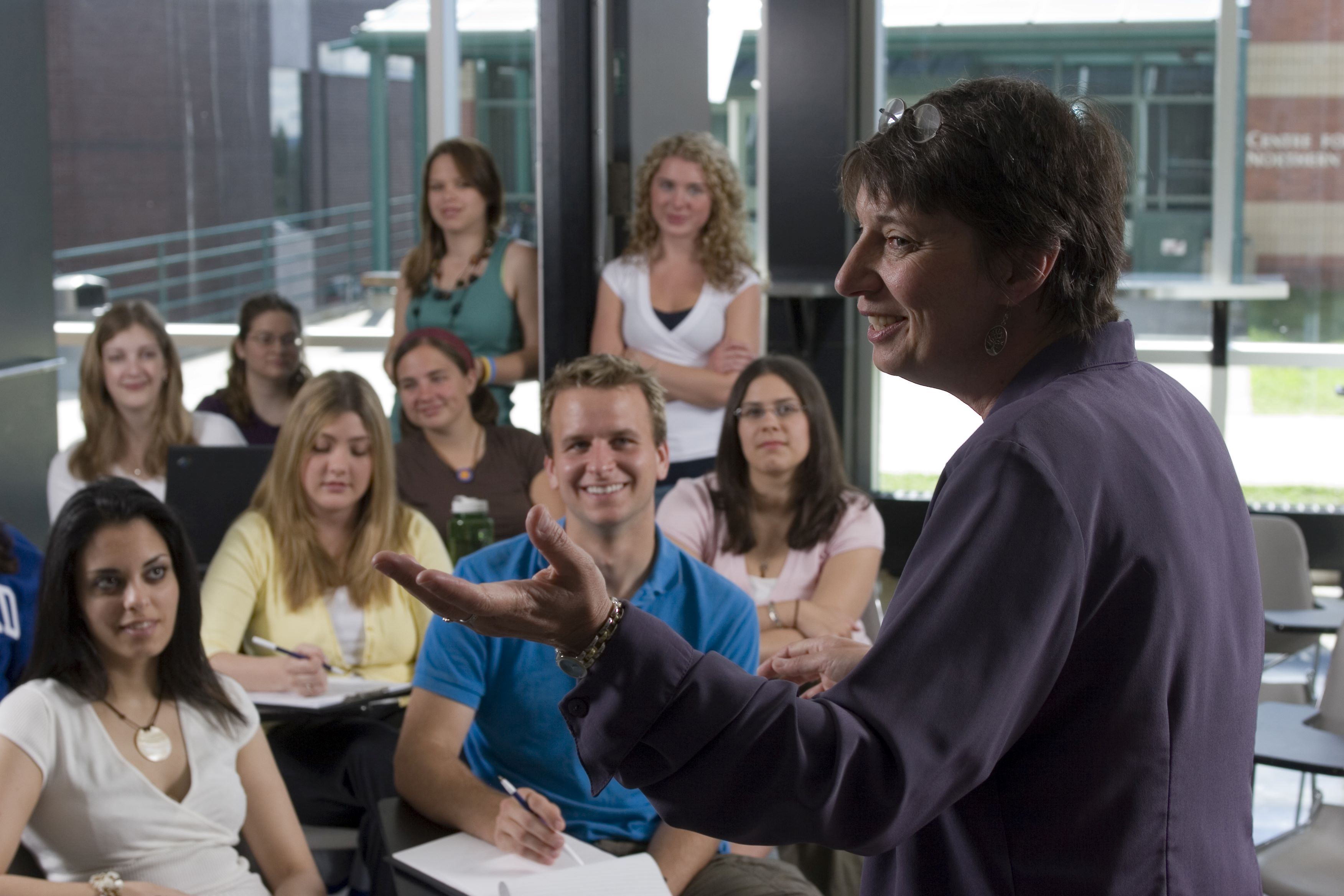 A professor teaching a class of students.