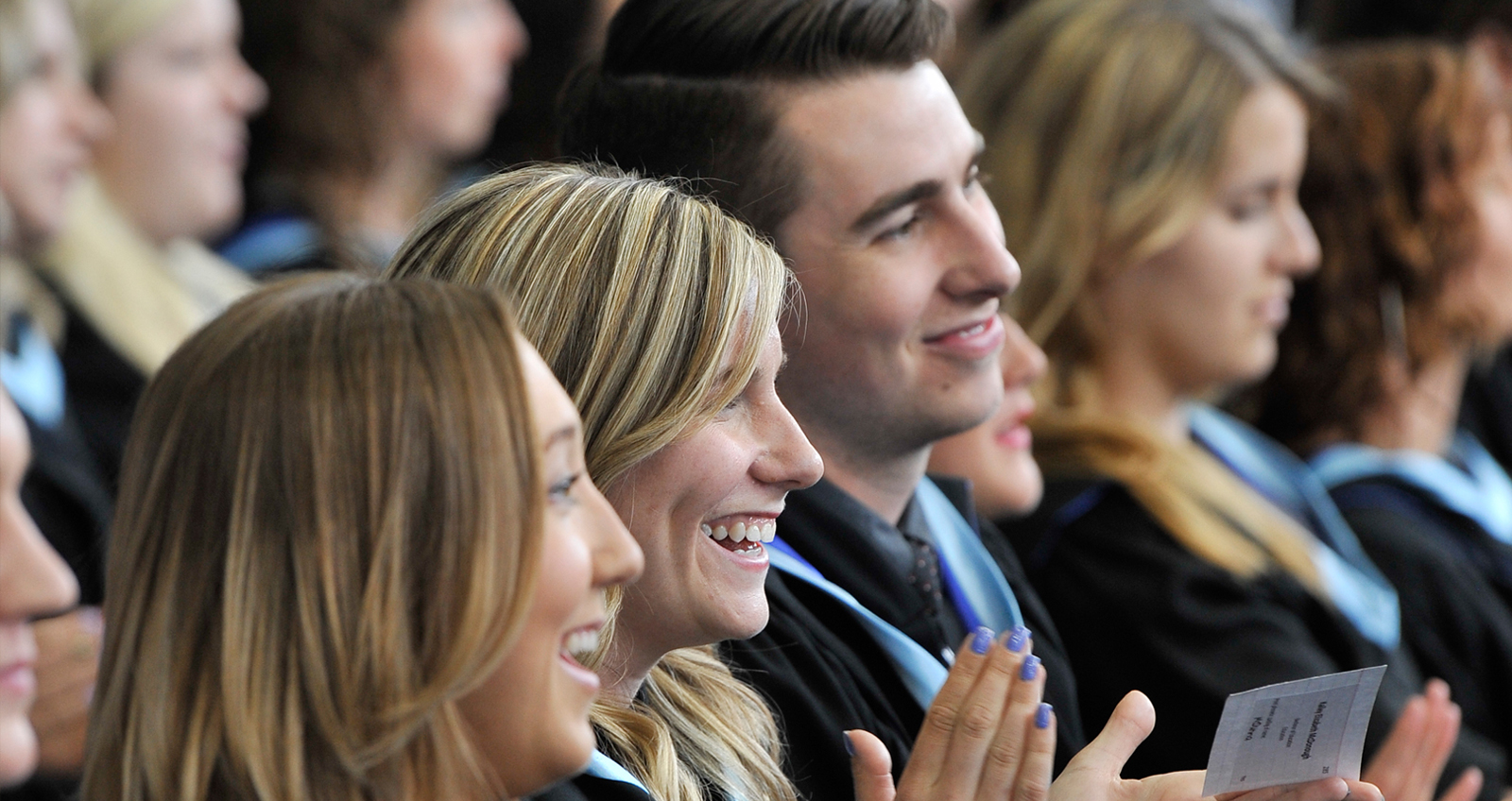 Students clapping during a convocation ceremony