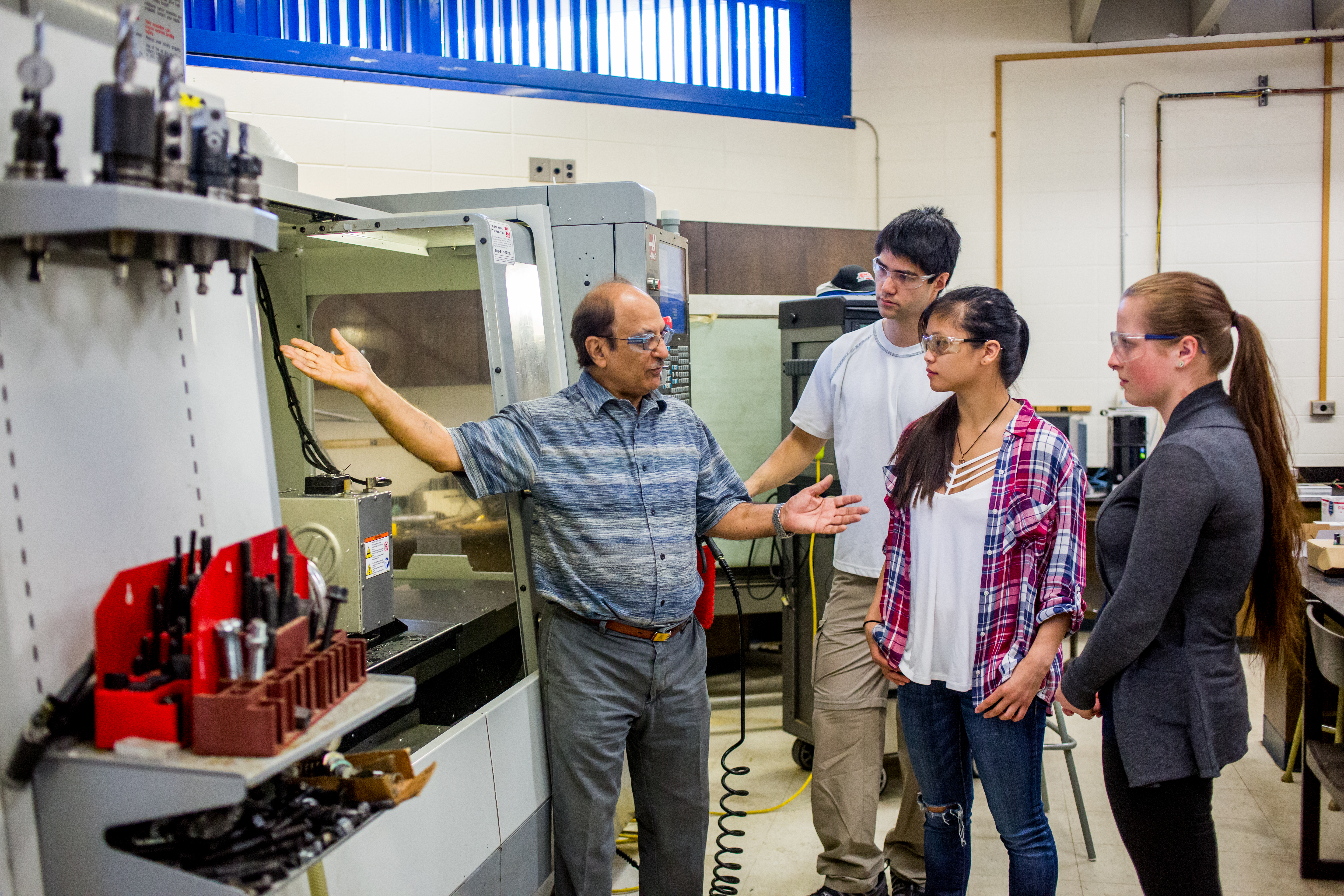 Students learning from instructor in a lab