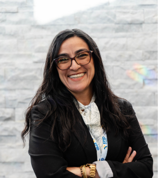 Portrait photo of Esperanza, a woman in business attire