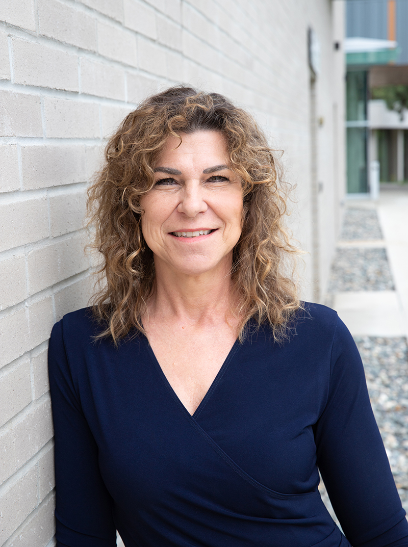 Dr. Gillian Balfour outside a building on thunder bay campus