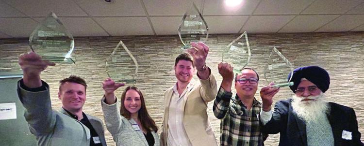 from left, Sasha Bubon, of Radialis; Avery Karpiak on behalf of researcher Kristof Karpiak; Jack Bull, with Haven by Shout Media; Kang Kang, researcher; and Tarlok Sahota, researcher with the Lakehead University Agricultural Research Station, during a ceremony at the Superior Inn on Thursday.