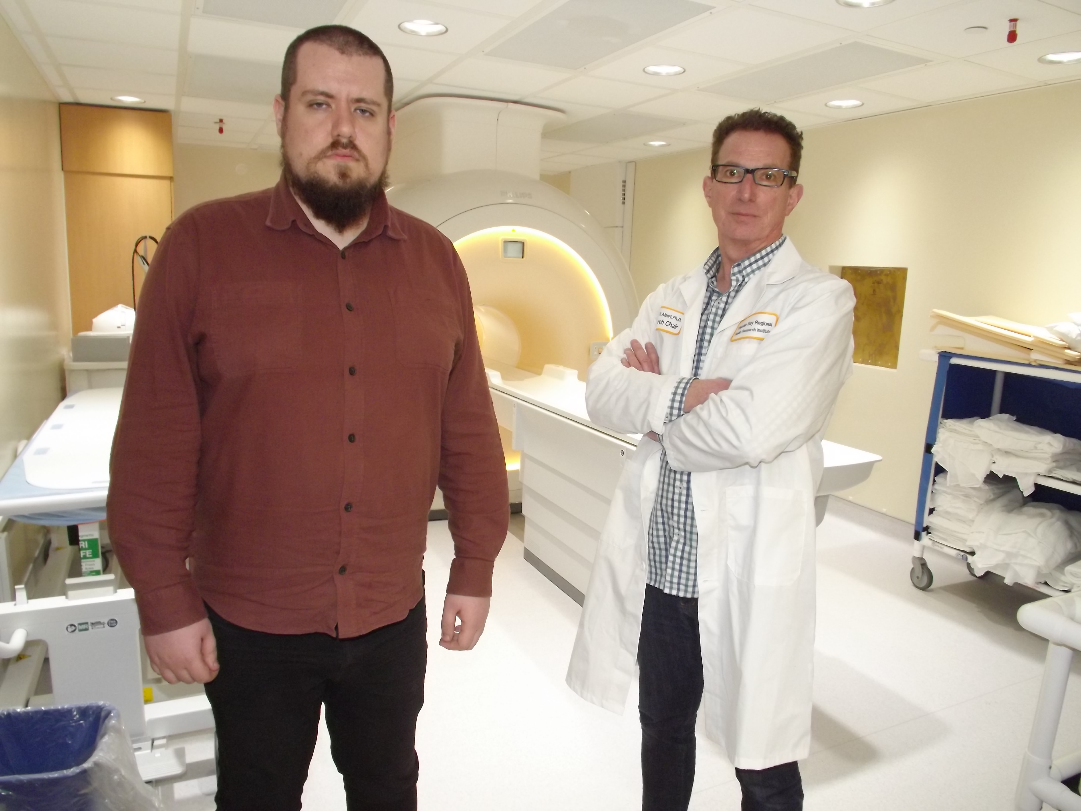 Dr. Mitchell Albert has been working on a medical imaging technique that uses xenon in MRIs. Here, Albert, right, is shown in front of an MRI scanner with Dr. Yurii Shepelytskyi