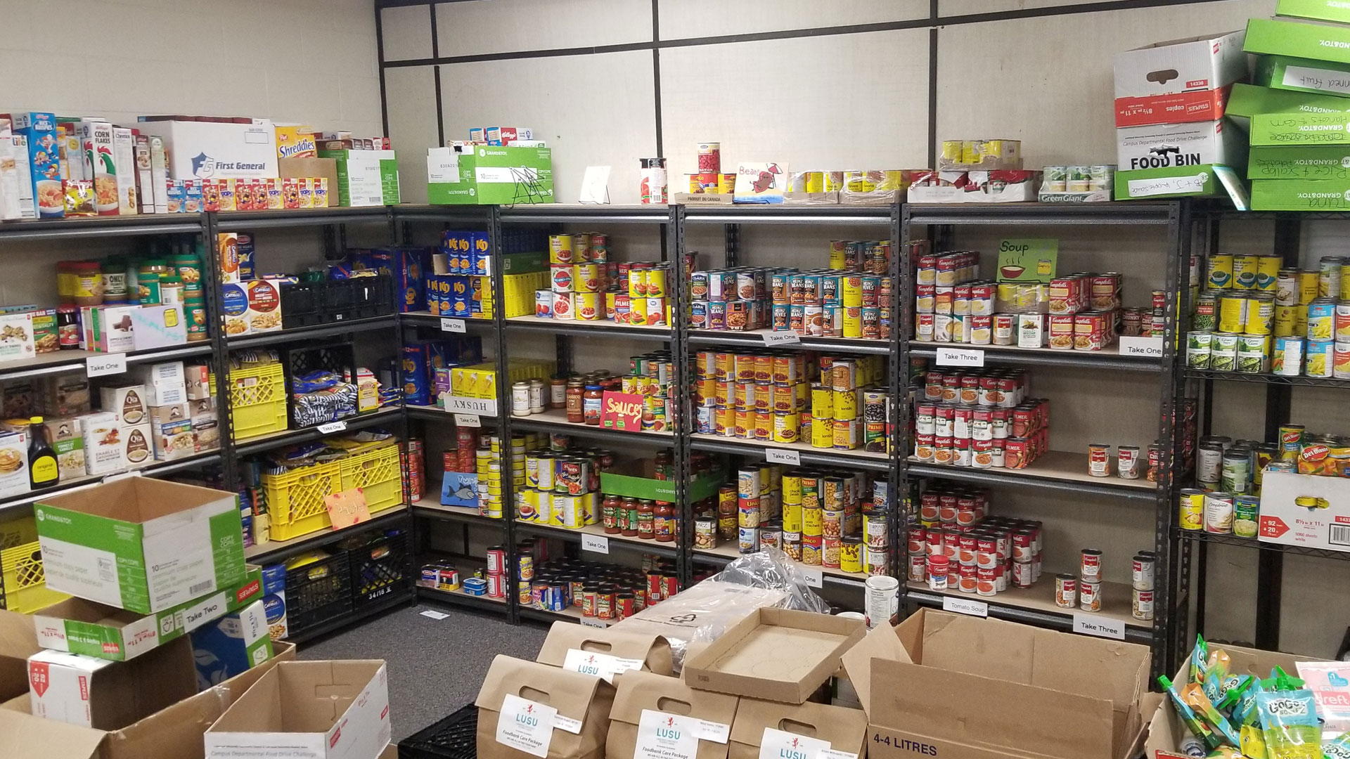 LUSU Food Resource Centre shelves stocked full of non perishable food items.