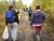A group of students walking down a trail