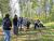 Attendees building a wood hut