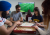 Students play a game of scrabble in the International Student Lounge