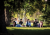 Students sitting outdoors on campus