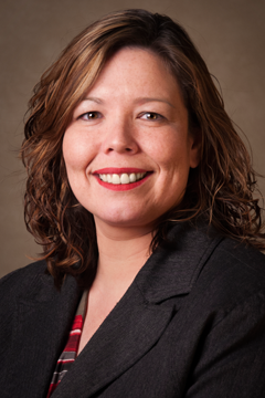 Deanna is smiling toward the camera in this portrait.