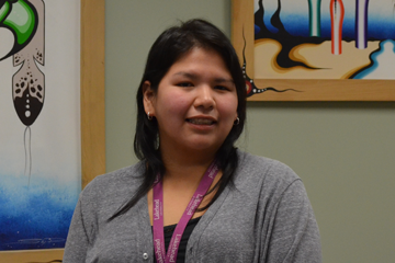 Rebecca looks to be in conversation with somebody to the left of the camera.