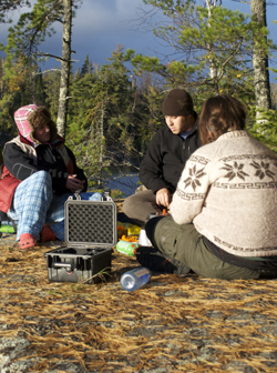 A photo of students reviewing some technology