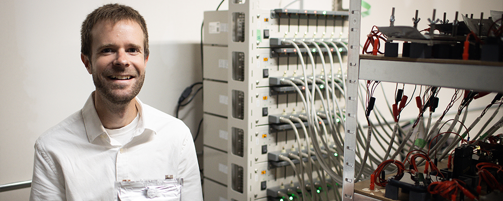 Brian Adams holding a salient energy storage system