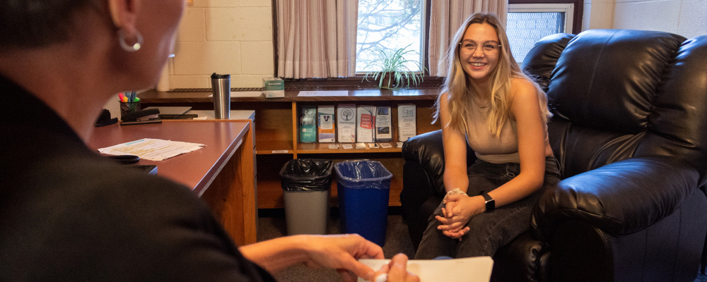 A student speaking to a counselor on Lakehead campus