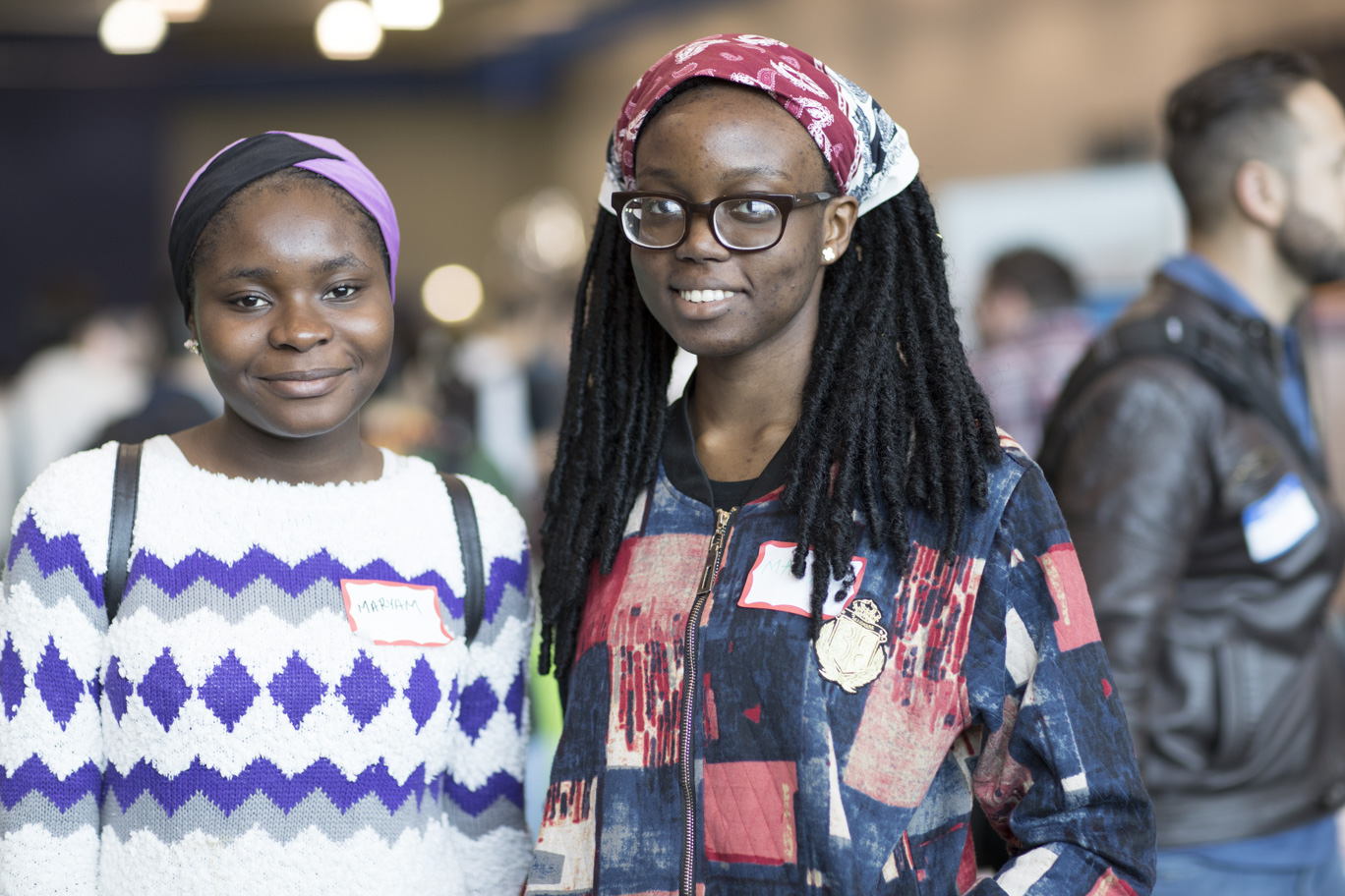 Two students smiling