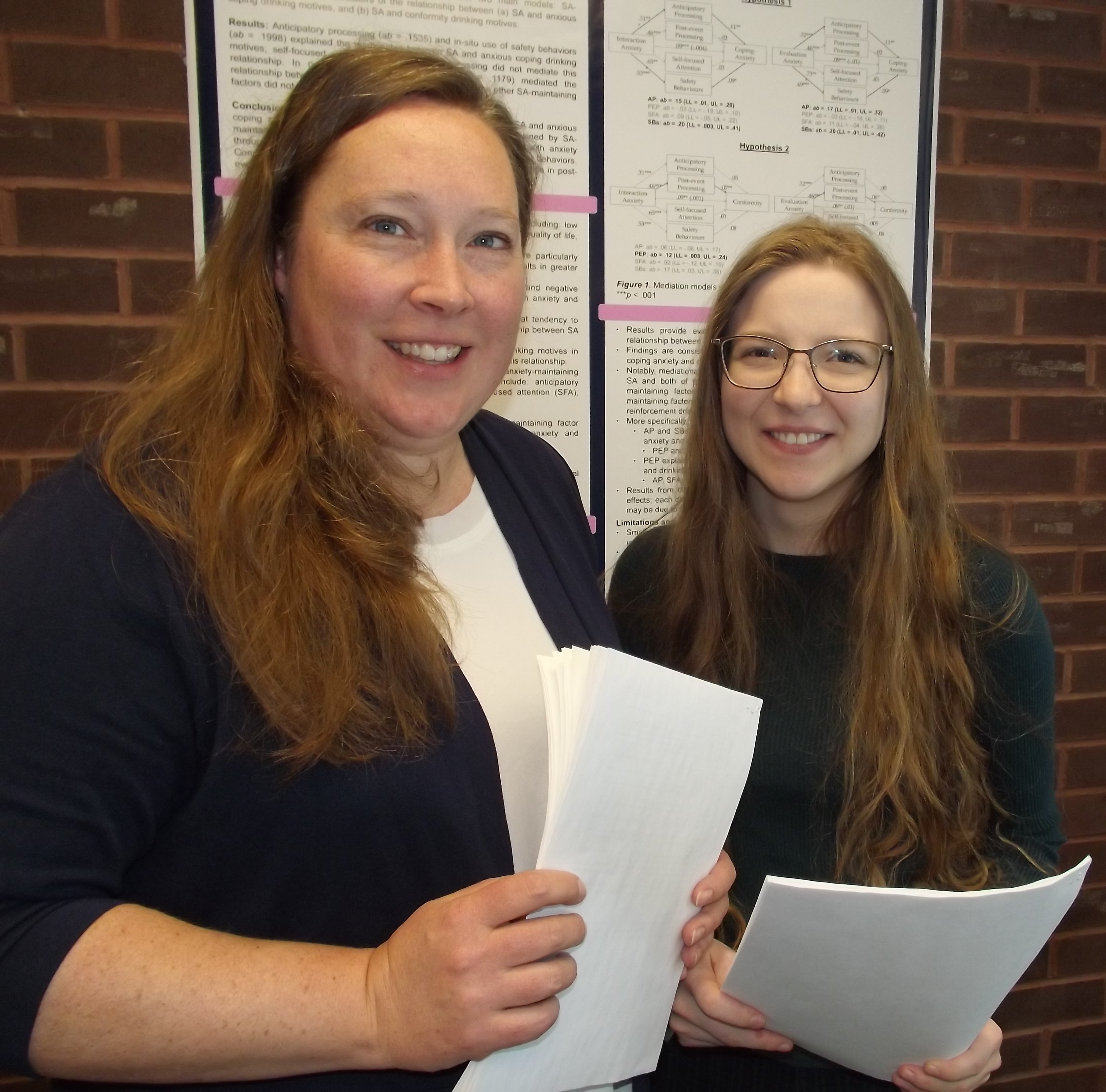 Dr. Amanda Maranzan, left, an associate professor in Lakehead's department of psychology, is leading a project examining the stigma experienced by injured workers. Pictured alongside her is graduate student Lauren Reynolds.