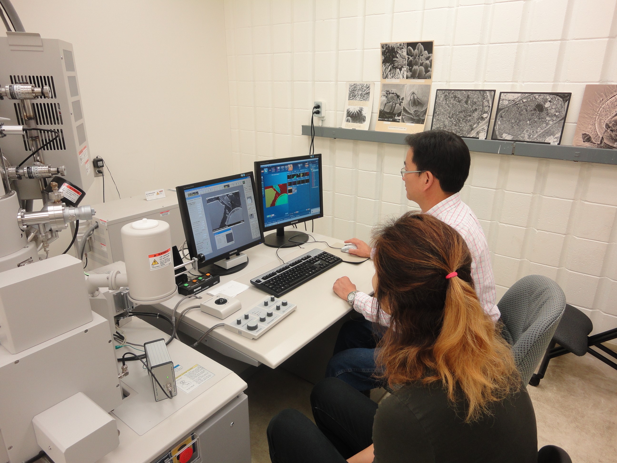 People Using Scientific Equipment at Lakehead University Instrumentation Laboratory