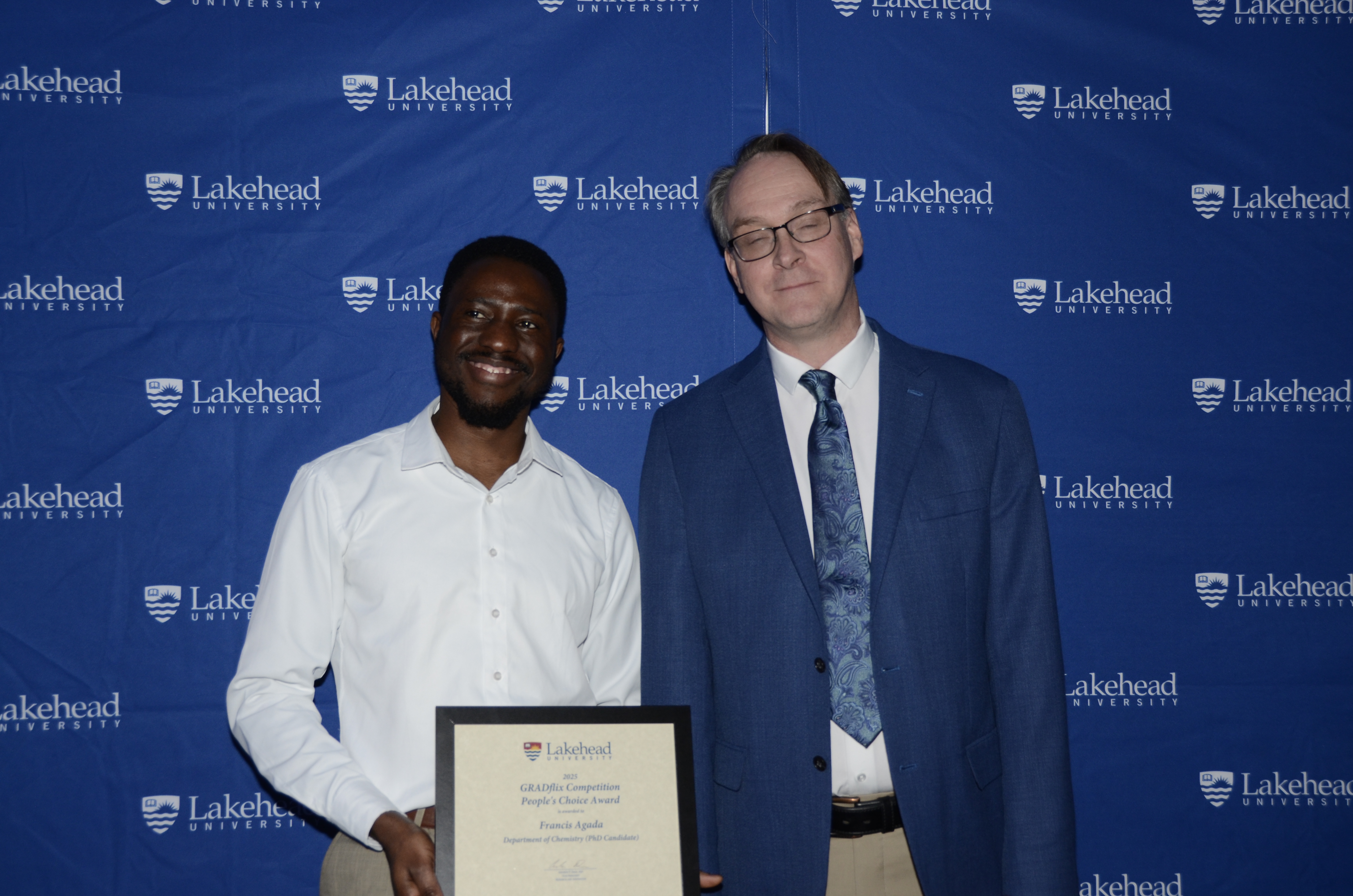 Photo of GRADflix Award People's Choice Award Winner with Acting Dean of Graduate Studies