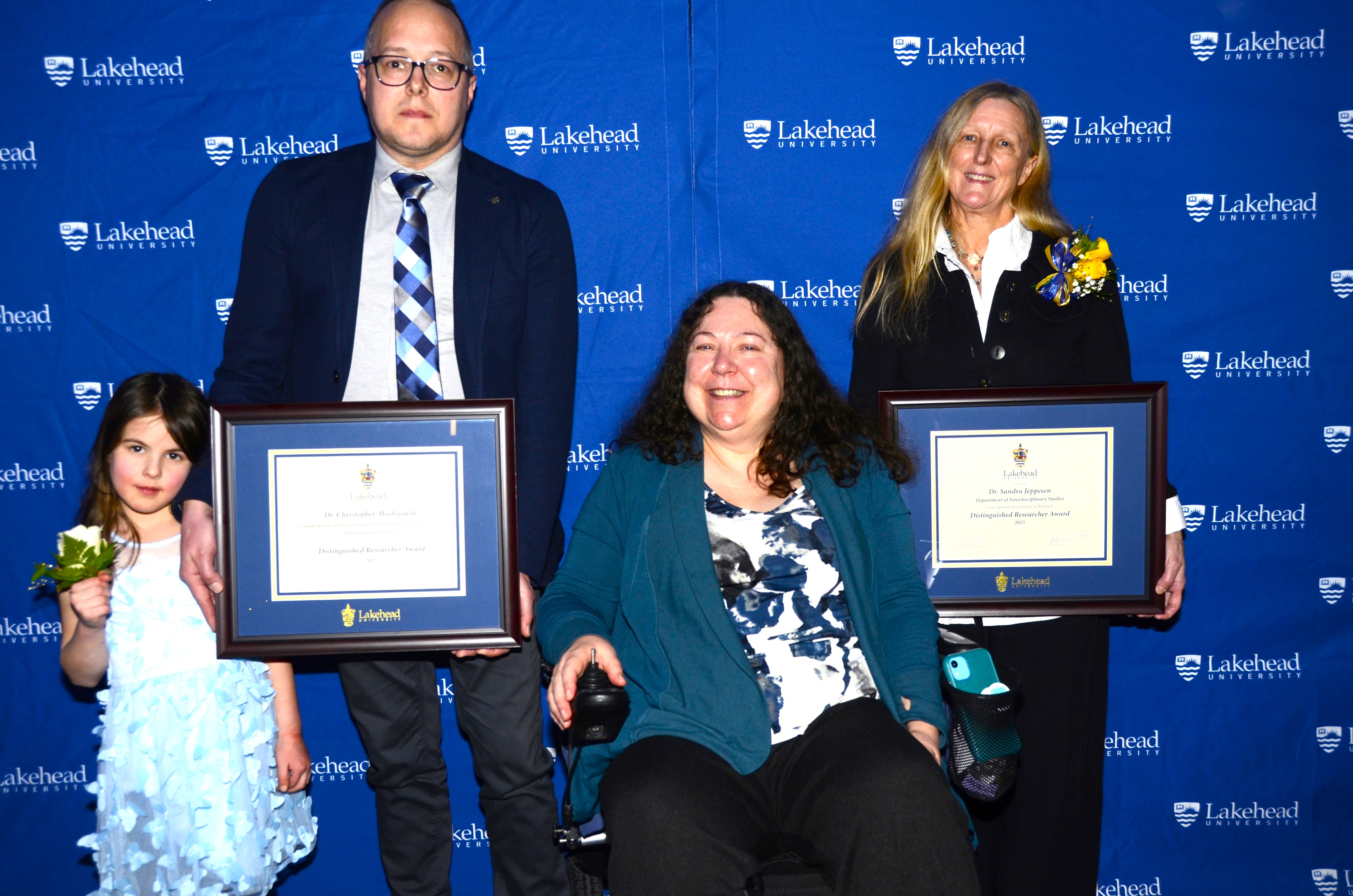Photo of DRA Winner, Dr. Christopher Mushquash, Canada Research Chair in Indigenous Mental Health & Addictions, Department of Psychology, Dr. Tamara Varney Chair, Senate Research Committee; Dr. Sandra Jeppesen, Department of Interdisciplinary Studies