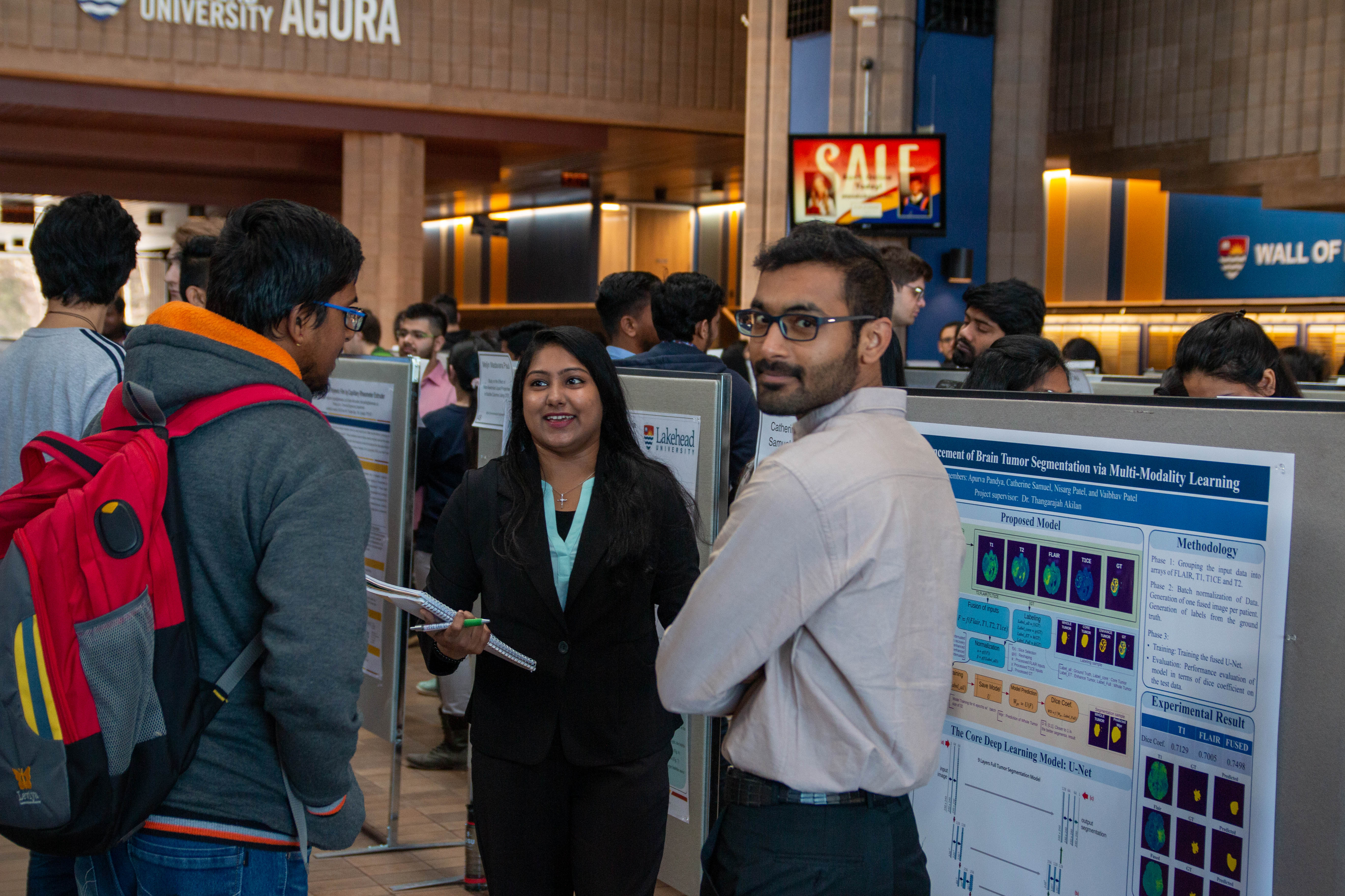 Photo of Students Participating in Graduate Student Conference Poster Session