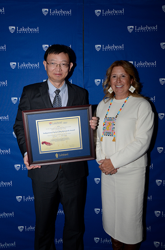 Indigenous Partnership Research Award winner, Dr. Jian Deng, Department of Civil Engineering, with Denise Baxter, Vice-Provost, Indigenous Initiatives