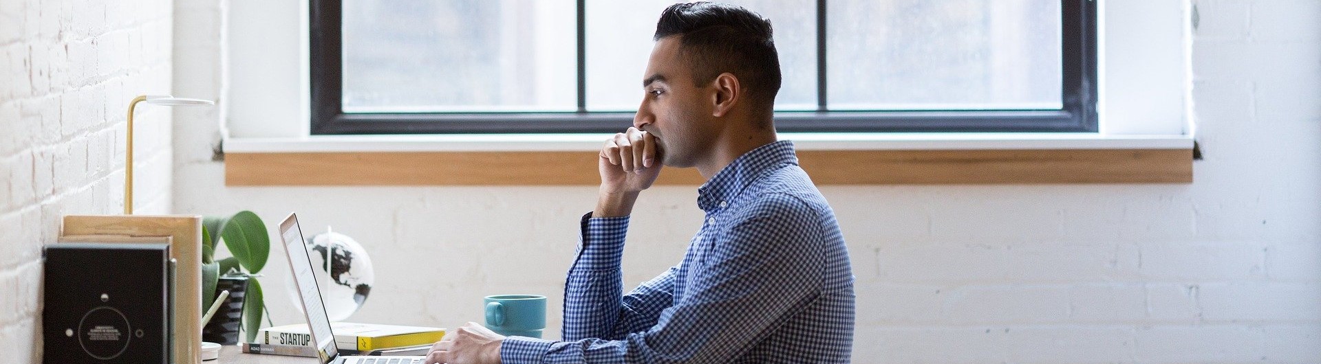 Person Working at Laptop