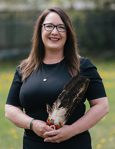 Cora with ceremonial feather