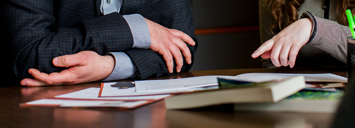 Student and Advisor looking through Scholarship Options