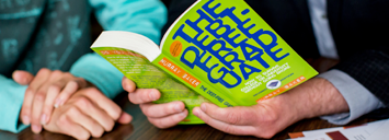 Student going through options with Lakehead assistance, utilizing "The Debt Free Graduate" book