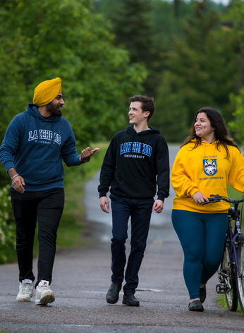 Students walking a campus path and exploring the natural wonder of Lakehead